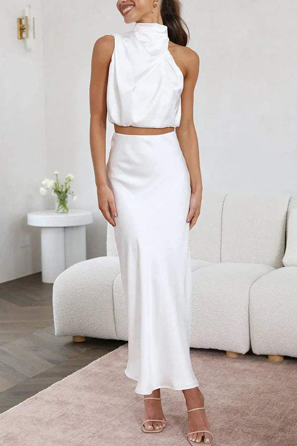 Conjunto elegante de mujer con top sofisticado y falda larga fluida