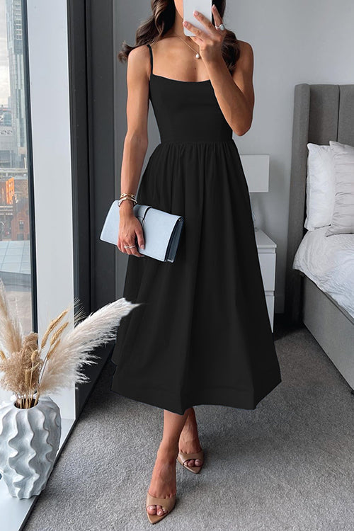 Vestido midi de tirantes finos con corte evasé y cintura marcada