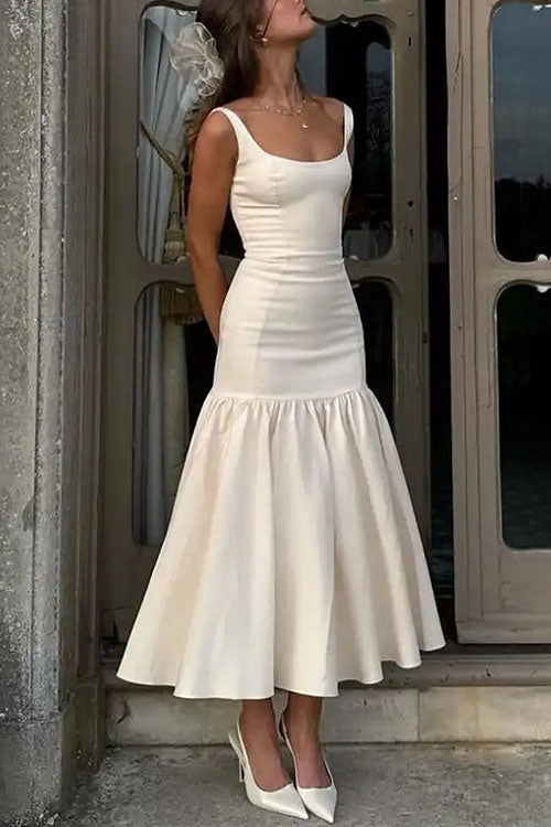 Vestido midi sin mangas con escote redondo y volantes ideal para un look elegante y moderno