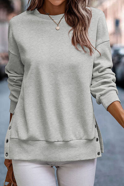Sudadera con cremallera y escote redondo en los hombros