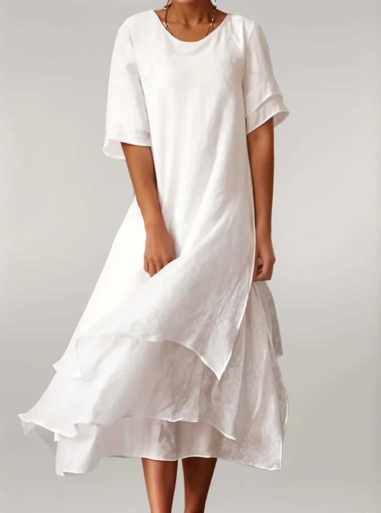 Vestido largo con falda en capas y mangas tres cuartos para un look sofisticado