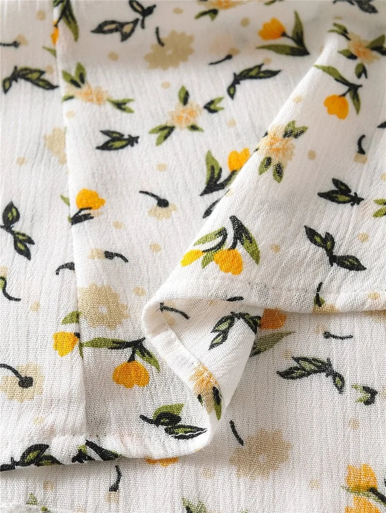 Vestido midi veraniego con escote en V y mangas abullonadas con delicado estampado floral