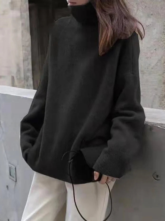 Elegante suéter extragrande con mangas largas y cuello alto