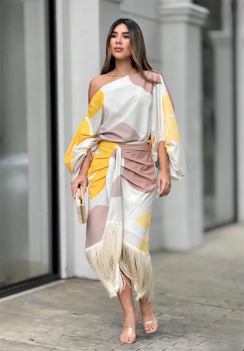 Conjunto elegante de blusa con mangas abullonadas y falda con flecos