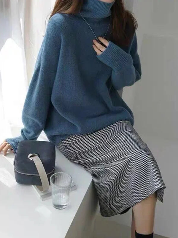 Elegante suéter extragrande con mangas largas y cuello alto