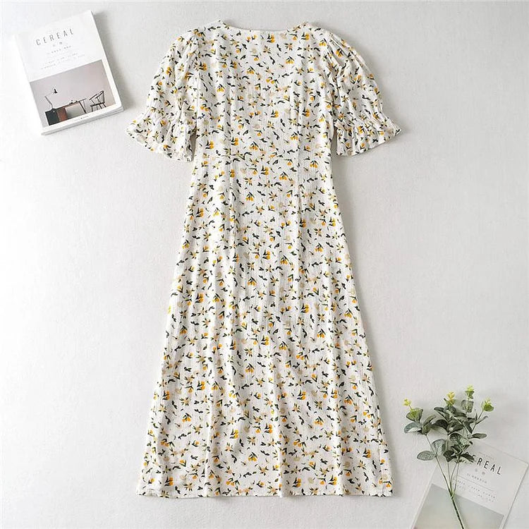 Vestido midi veraniego con escote en V y mangas abullonadas con delicado estampado floral