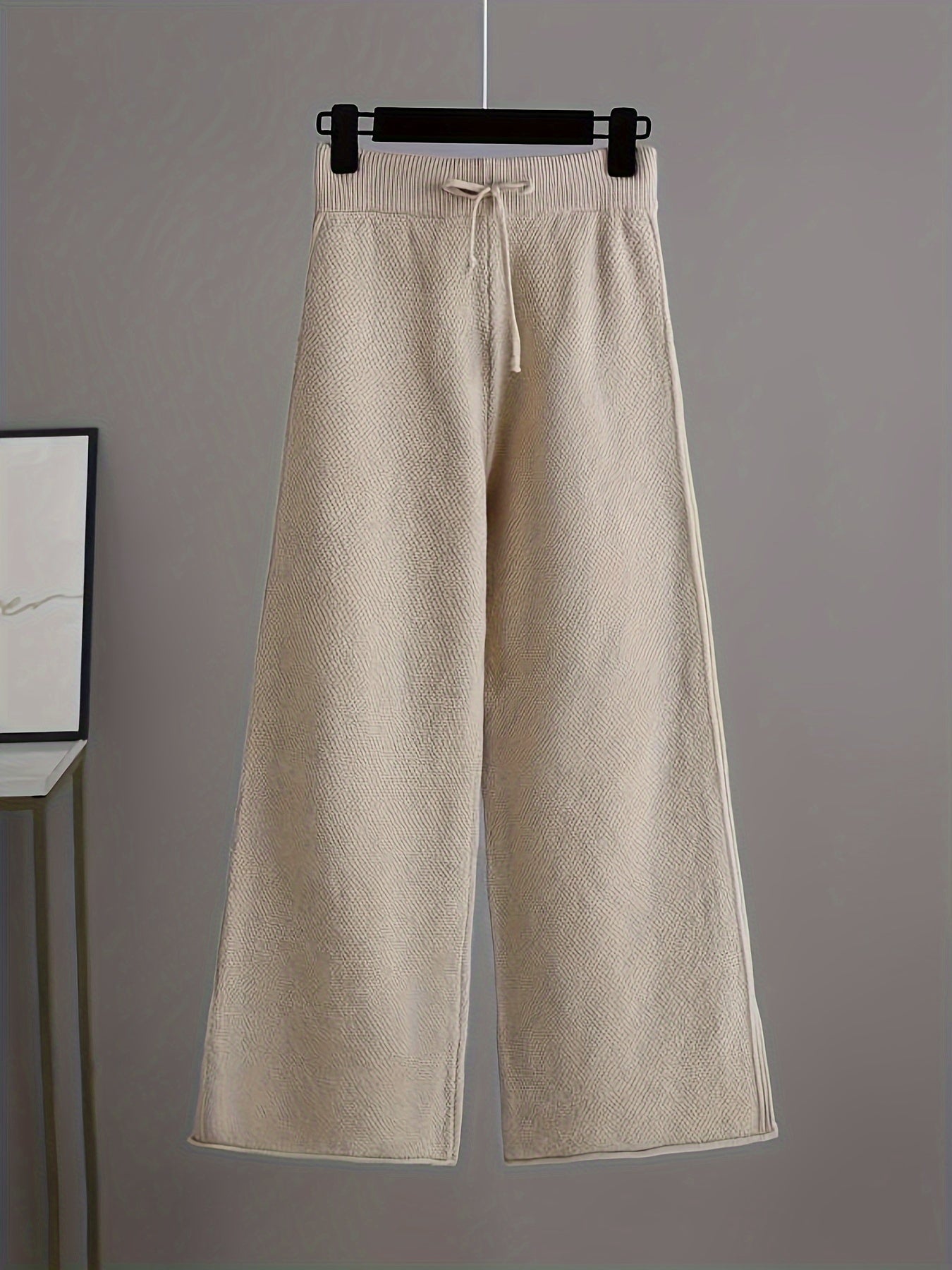 Conjunto elegante de jersey y pantalones anchos para mujer