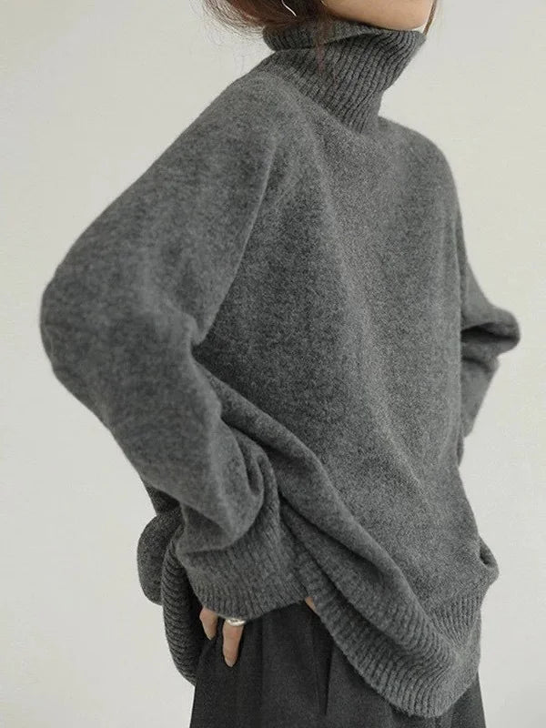 Elegante suéter extragrande con mangas largas y cuello alto