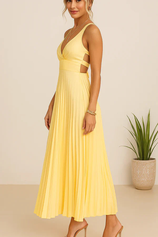 Vestido largo veraniego con escote pronunciado espalda descubierta y falda plisada elegante