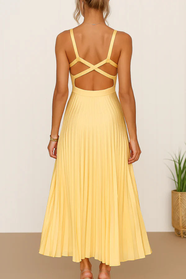 Vestido largo veraniego con escote pronunciado espalda descubierta y falda plisada elegante