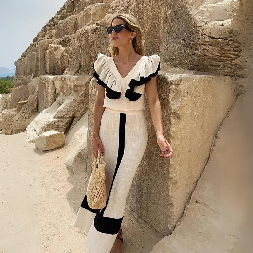 Conjunto sofisticado de dos piezas con elegantes detalles de volantes