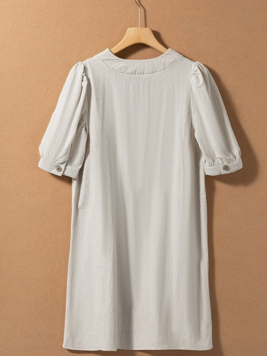 Vestido mini de manga larga con cuello redondo y diseño elegante para un mira sofisticado