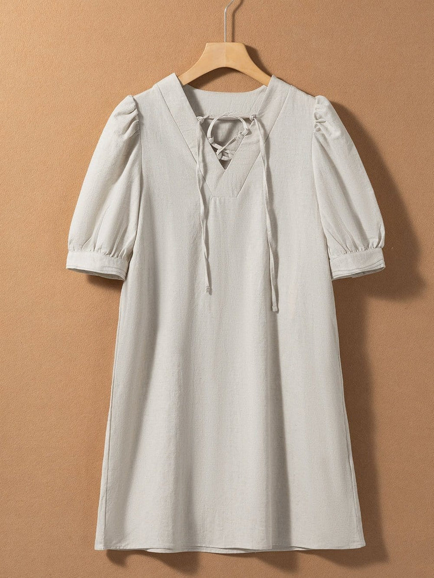Vestido mini de manga larga con cuello redondo y diseño elegante para un mira sofisticado