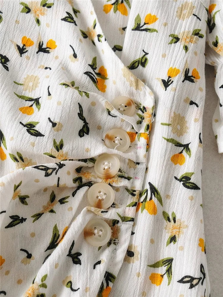 Vestido midi veraniego con escote en V y mangas abullonadas con delicado estampado floral