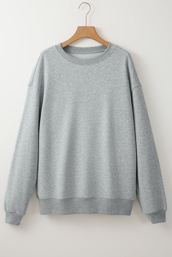 Sudadera Gris Claro con Cuello Redondo y Corte Holgado - Casual y Cómoda