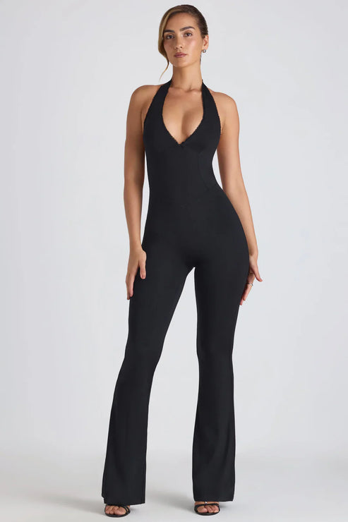 Mono halter elegante con escote en V profundo espalda abierta y pantalón ancho