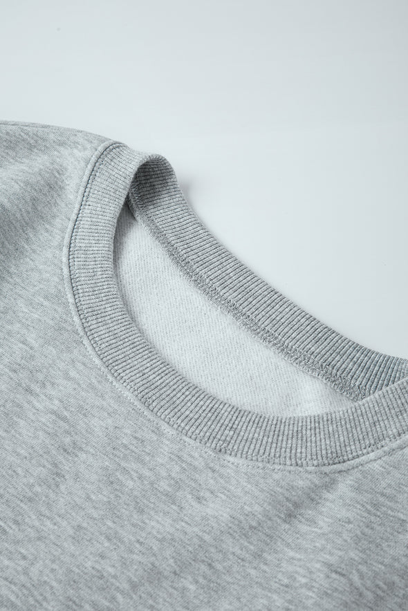 Sudadera Gris Claro con Cuello Redondo y Corte Holgado - Casual y Cómoda