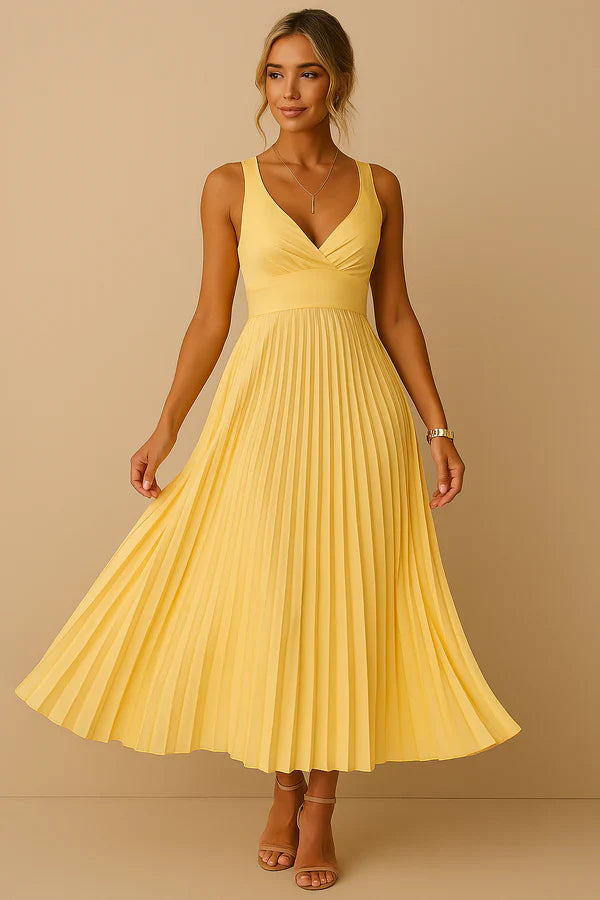 Vestido largo veraniego con escote pronunciado espalda descubierta y falda plisada elegante