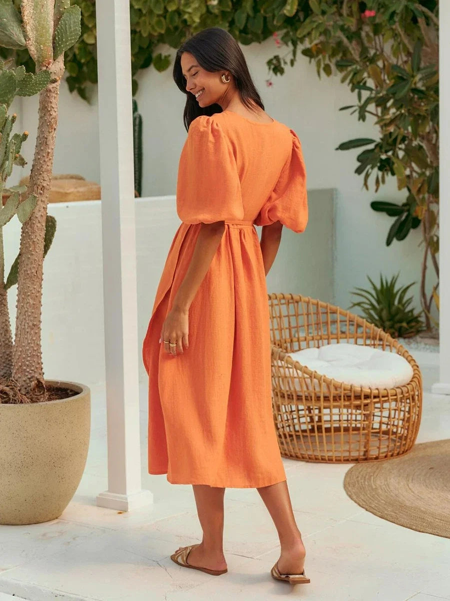 Vestido largo con corte evasé y mangas cortas abullonadas