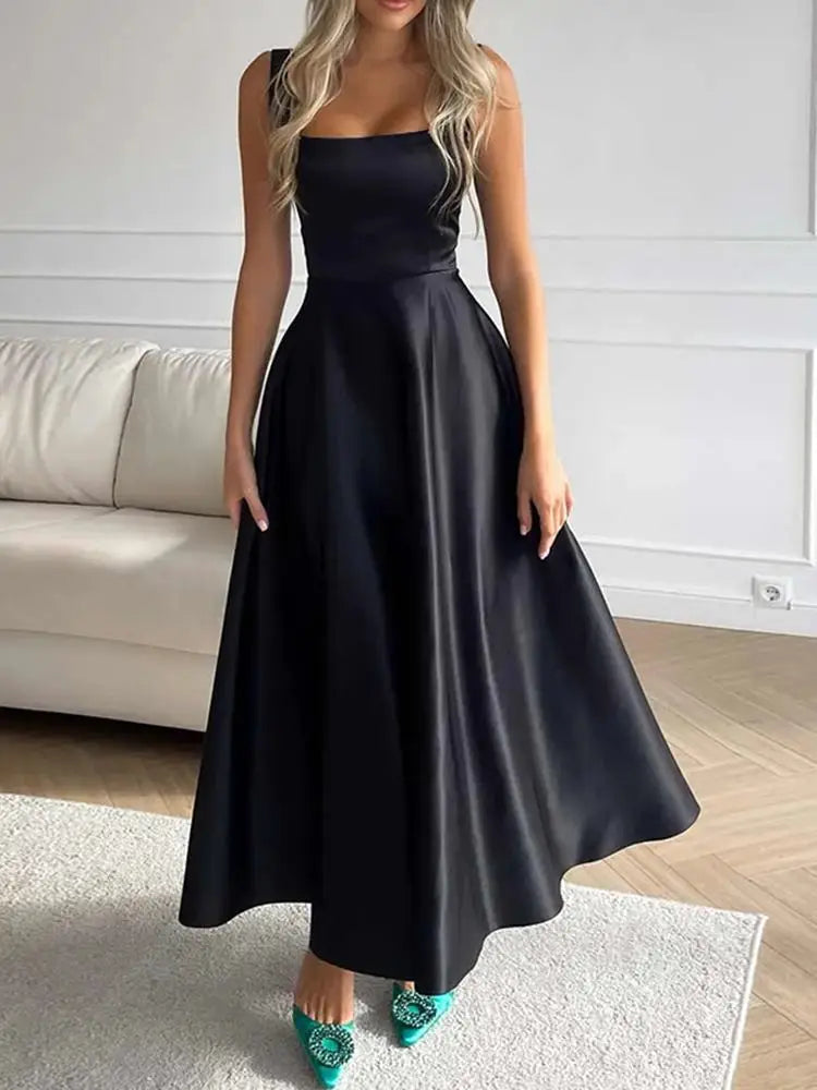 Vestido midi de noche con tirantes y falda amplia elegante