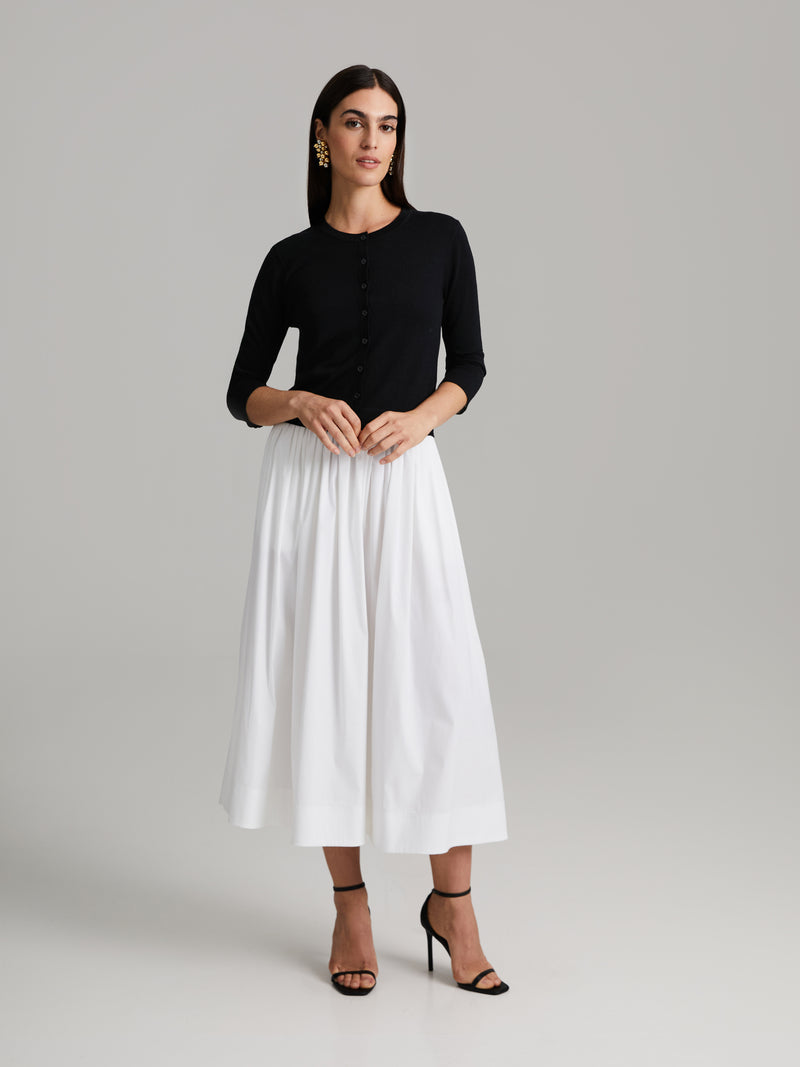 Falda midi amplia con estilo actual para un mira versátil