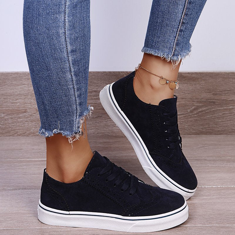 Elegantes zapatillas planas con cordones